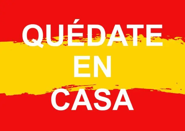 Vector illustration of Vector motivational poster Quedate en casa, english translation Stay Home on flag of Spain.