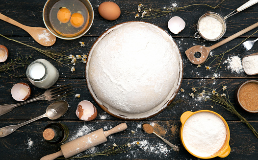 Top view of dough, making ingredients and utensils