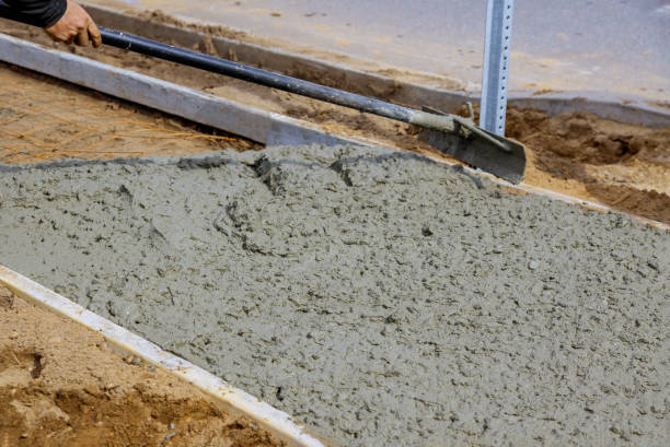 istock Making of a freshly poured cement sidewalk 1214288973