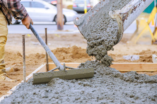 istock Newly poured on laying concrete cement with sidewalk 1214289000