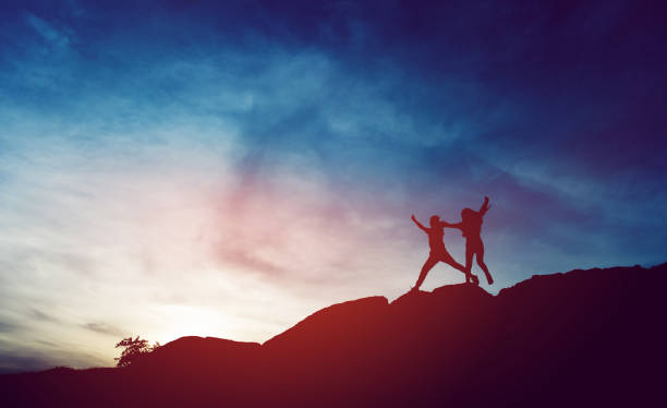 istock Silhouette of team leadership, teamwork and teamwork and delightful silhouette concepts 1214289580