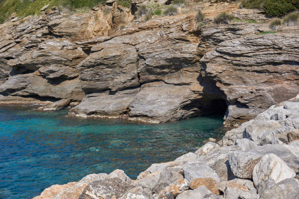 istock A cave in the rock at seaside 1214289731