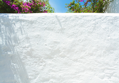 Detail of a white wall of traditional Greek house illuminated by sun. Photo taken with Canon 5D MkIV