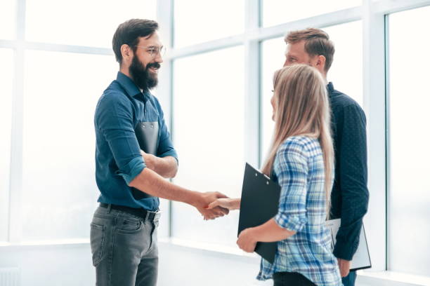 istock handshake business people in the office lobby . 1214291792