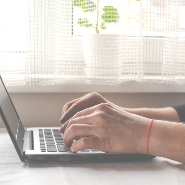 istock Freelancer works on a laptop in the home office 1214292946