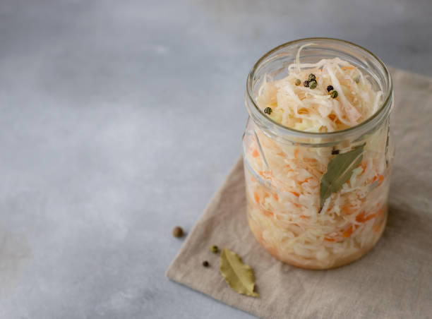 istock homemade sauerkraut in a jar. side view 1214294804