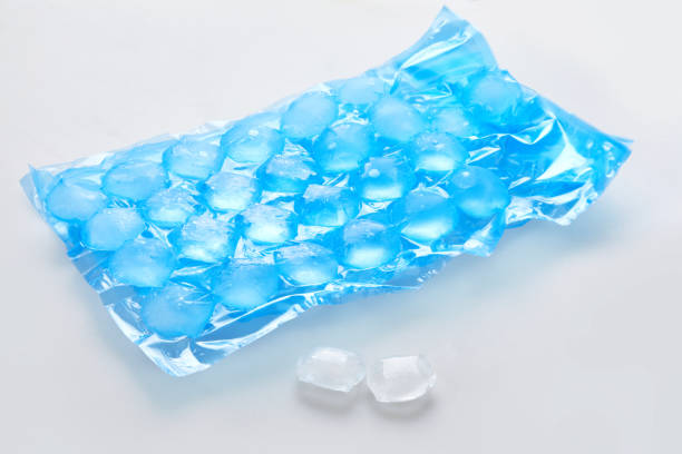 Blue plastic packaging ice bags for home water freezing. Blue plastic packaging ice bags for home water freezing. Ice cubes in plastic bag,  freezer for ice circle cubes isolated on white ice pack photos stock pictures, royalty-free photos & images