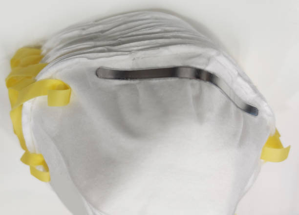 istock white protective hygenic mask isolated backgrounds for doctors and patient from CORONA COVID-19 virus biological infection and PM2.5 dust, pandemic news 1214297439