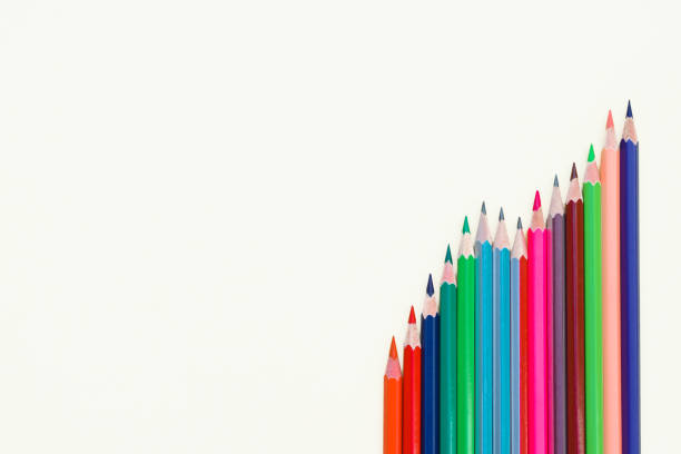istock Different colored pencil crayons arranged in a row on an isolated white paper background 1214297952