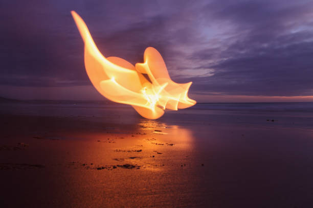 Lightpainting photo on a beach after Sunset.