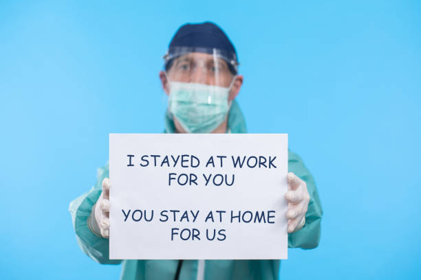 istock doctor holding a poster with the message 