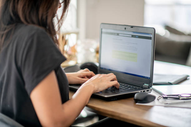 istock Beautiful young woman works from home during COVID-19 quarantine. 1214302090