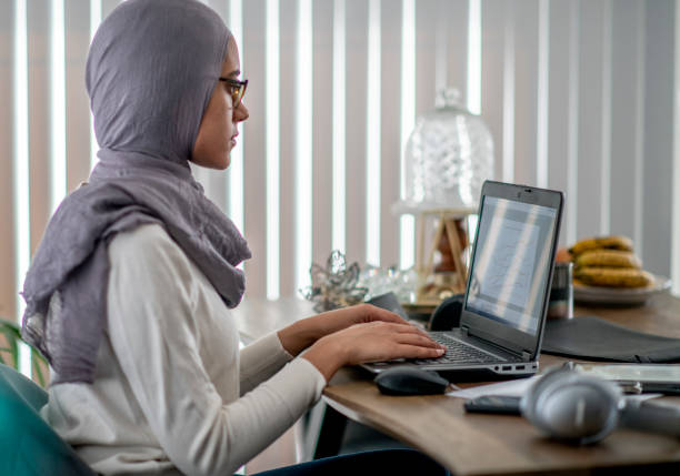 istock Beautiful young woman works from home during COVID-19 quarantine. 1214302516