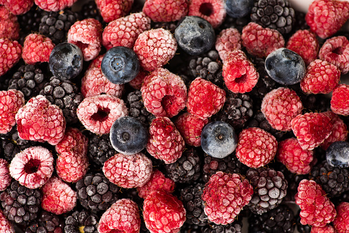 Bunch of frozen berry fruit making a background pattern