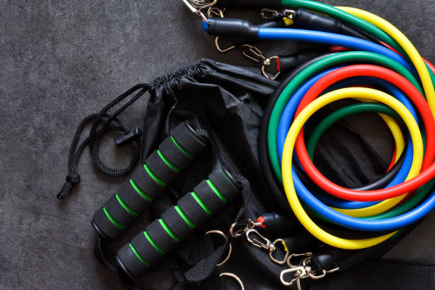 istock Sports accessory - expander with a carbine on a dark background. 1214303506