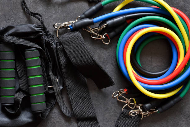 istock Sports accessory - expander with a carbine on a dark background. 1214303507