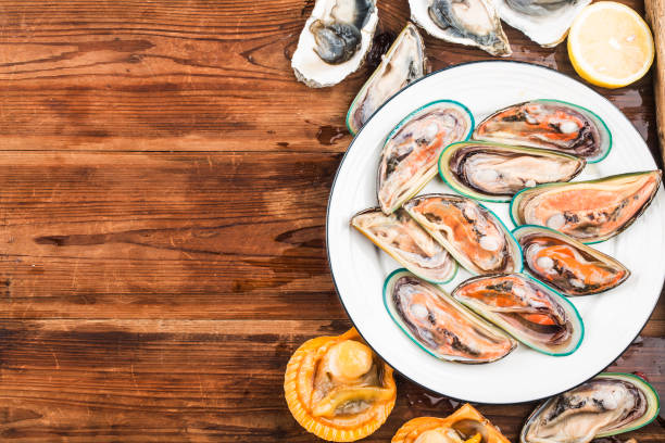 istock Assorted fresh shellfish-Green Mussels, Oysters, Scallops 1214303908
