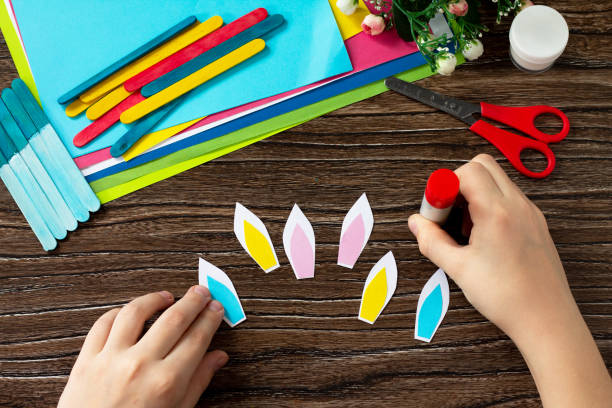 istock Instruction, step 6. Easter bunny toy gift stics puppets. Handmade. Project of children's creativity, handicrafts, crafts for kids. 1214304582