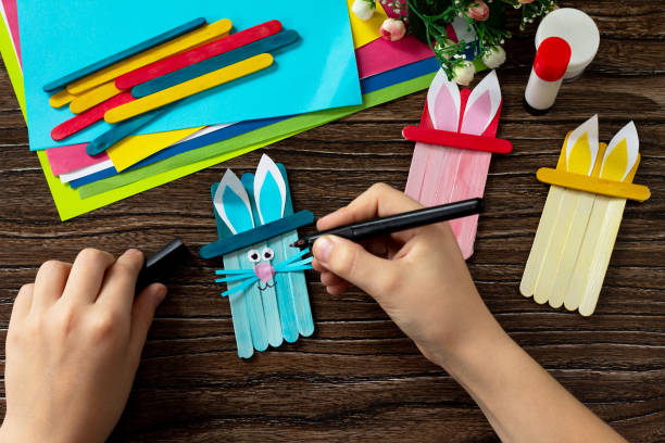 istock Instruction, step 10. Easter bunny toy gift stics puppets. Handmade. Project of children's creativity, handicrafts, crafts for kids. 1214304606