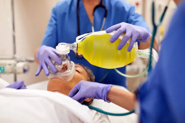 Photo of Close up view of  manual medical ventilator on a patient.