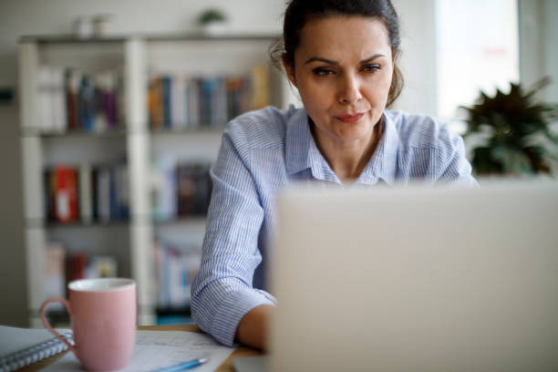 istock Mature woman working from home 1214306022