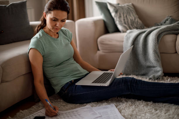 istock Mature woman working from home 1214307003