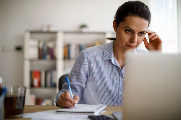 istock Mature woman working from home 1214307180