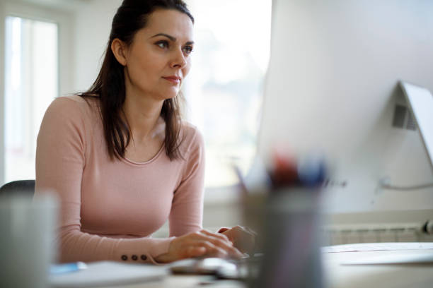 istock Mature woman working at home 1214307332