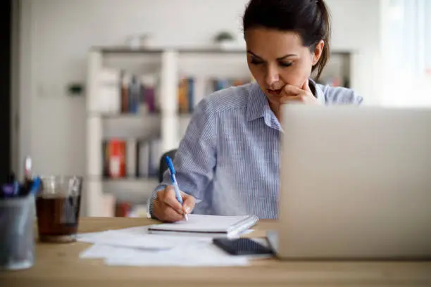 Photo of Mature woman working from home