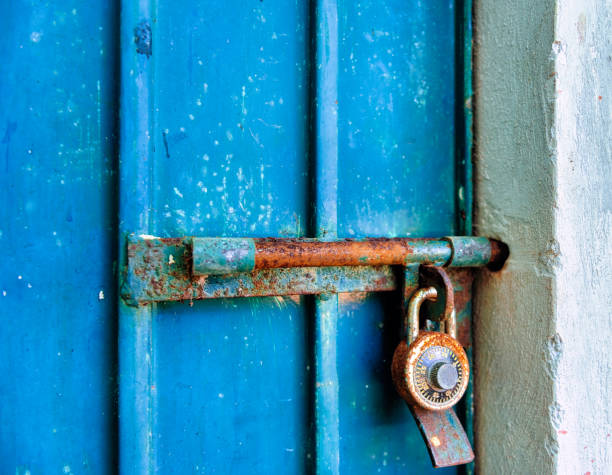 istock Old Blue Metal Door with Combination Lock 1214310910