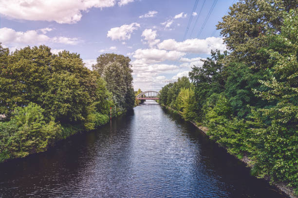 istock beautiful Berlin canal with bridge and cloudscape 1214311220