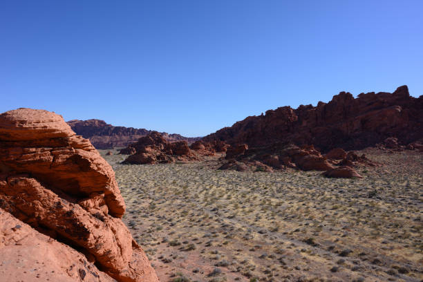 istock Standing Atop Sandstone Formation Looking Out 1214313930
