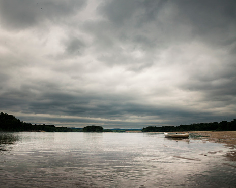 Canoe on the banks of the Wisconsin River on a stormy spring day. in Madison, WI, United States