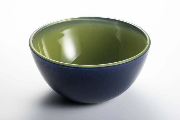 istock Empty blue and green bowl on the white background 1214315144