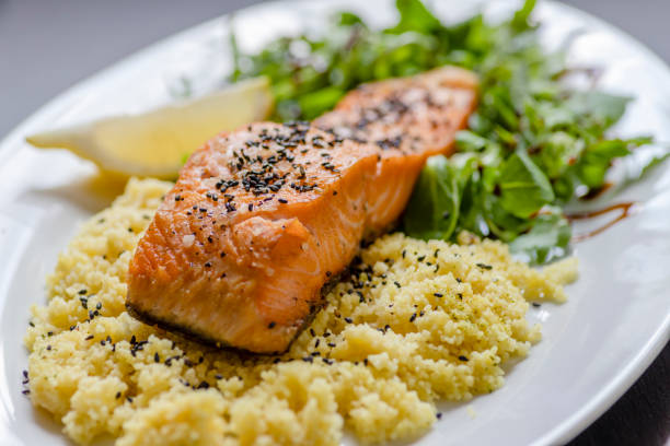 istock baked salmon with spinach salad and couscous 1214315194