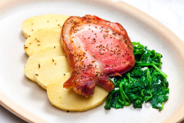 istock smoke meat with spinach and potato dumplings 1214315506