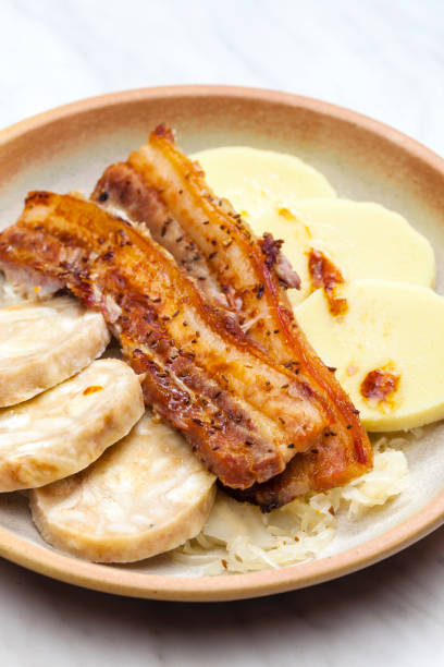 istock pork meat with two types of dumplings and cabbage 1214315599