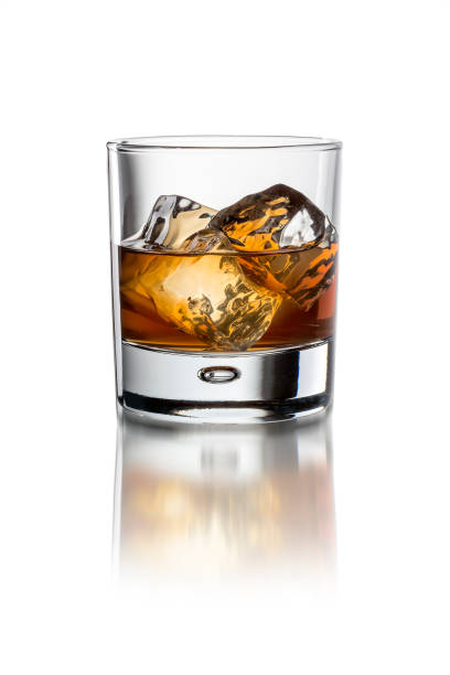istock Glass with whiskey on the white background with ice 1214315805