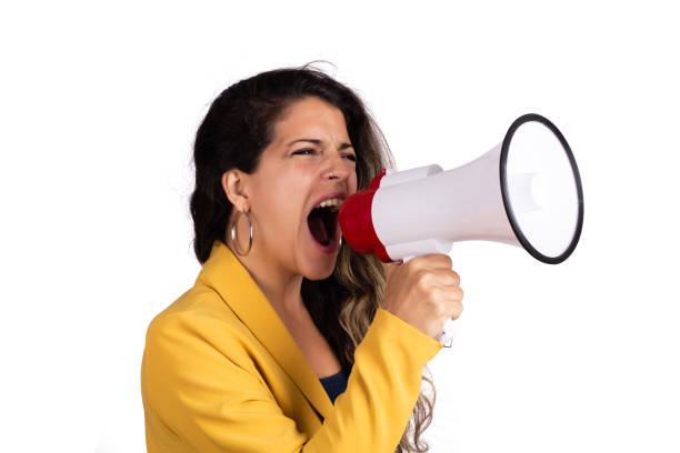 istock Woman screaming on a megaphone. 1214317176