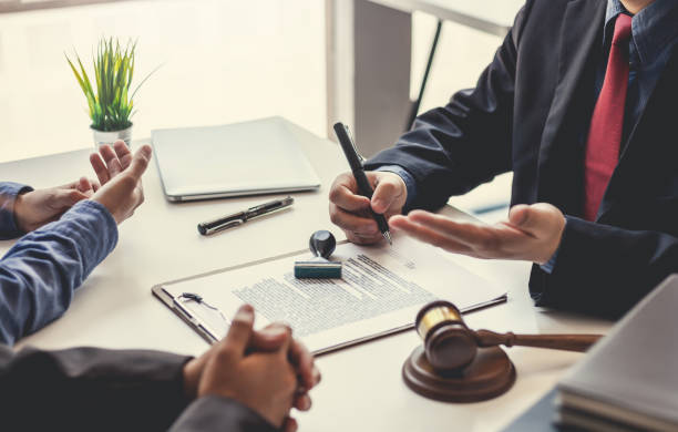 Business people and lawyers talk and contract together. Signing of a contract in the presence of an attorney. Business people and lawyers talk and contract together. Signing of a contract in the presence of an attorney. lawsuit photos stock pictures, royalty-free photos & images