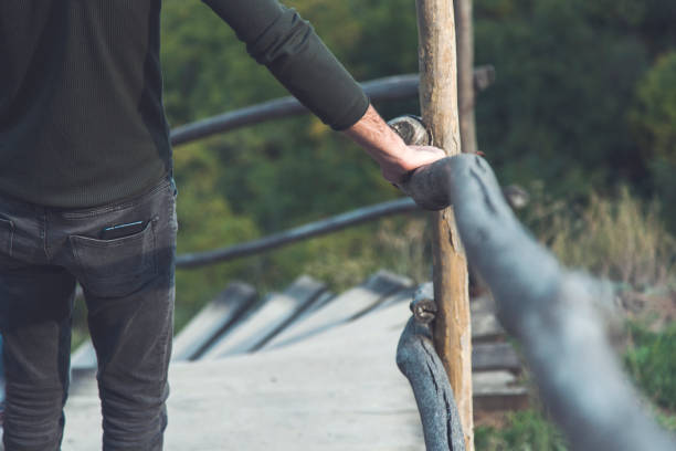 istock man on the wooden stairs 1214318172