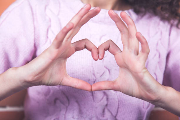 istock happy woman hand in heart 1214318630