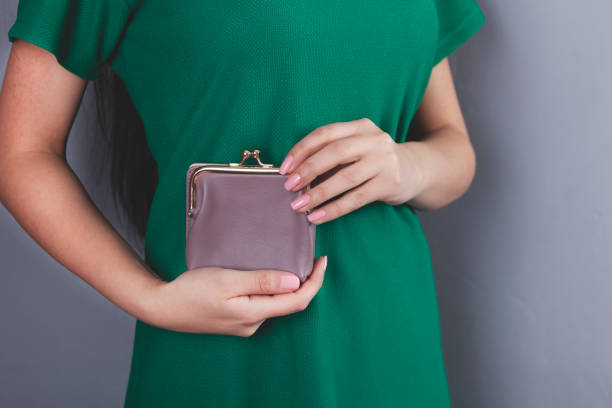 istock woman hand money with wallet 1214319644