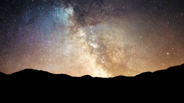 istock Bright Shining Stars in Night Sky and Milky Way Galaxy Time Lapse - Abstract Background Texture 1214320023