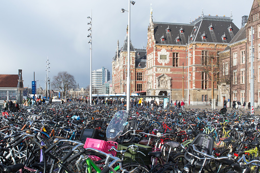 Bicycles are parked in the central square near the train station in Amsterdam.