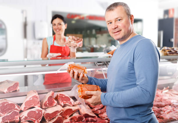 istock Satisfied happy male customer posing in shop 1214321072