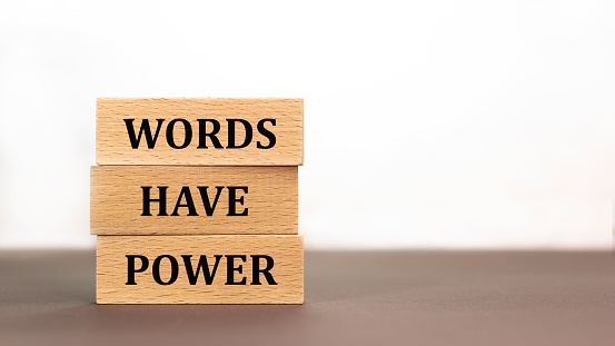 words have power on wooden blocks on white background