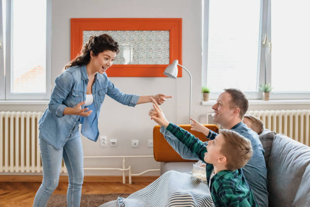 istock Happy Family Playing Charades 1214324964