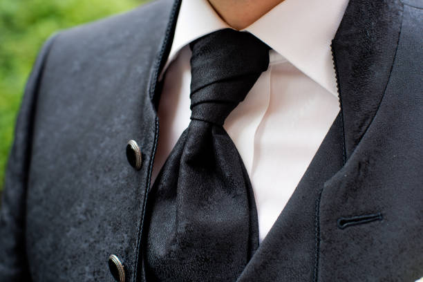 istock A man in a black jacket and black tie. Close-up. 1214325390