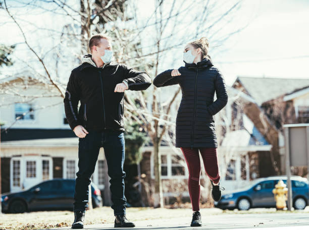 istock COVID-19, Young couple meeting outside 1214326767